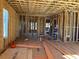 Interior framing of a new home, showcasing the open floor plan and framework with a ladder and construction materials at 001 White St # 1, Marietta, GA 30060