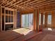 Interior framing of a new home, showcasing the fireplace, sliding glass door, and construction progress at 001 White St # 1, Marietta, GA 30060