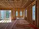 Interior framing of a new home, showcasing the structure with large windows and a sliding glass door at 001 White St # 1, Marietta, GA 30060