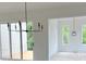 Bright living room with sliding doors to the deck and a modern chandelier at 001 White St # 1, Marietta, GA 30060