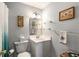 Bathroom with a white sink, matching toilet, and bright lighting at 1501 Clairmont Rd # 535, Decatur, GA 30033