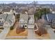 An aerial view of a two-story home with a three-car garage and a well-manicured front yard at 2061 Westwood Cir, Smyrna, GA 30080