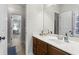 Bathroom featuring a vanity with a mirror and a view into an adjoining room at 2061 Westwood Cir, Smyrna, GA 30080