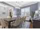 Dining room featuring hardwood floors, a modern chandelier, and a view of the front entrance at 2061 Westwood Cir, Smyrna, GA 30080