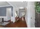 Inviting foyer with hardwood floors, elegant wainscoting, and a view into the living room at 2061 Westwood Cir, Smyrna, GA 30080