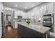 Well-lit kitchen featuring granite countertops, stainless steel appliances and direct access to the dining area at 2061 Westwood Cir, Smyrna, GA 30080