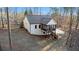 Aerial view of the home, featuring a cozy screened in porch, and wooded surroundings at 210 Joe Green Ln, Canton, GA 30114