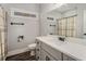 Bathroom featuring single sink vanity with granite counters, modern fixtures, and natural light at 210 Joe Green Ln, Canton, GA 30114