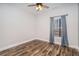 Bedroom featuring wood flooring, neutral walls, and a large window with natural light at 210 Joe Green Ln, Canton, GA 30114