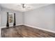 Spacious bedroom with wood flooring, neutral walls, and a large window with natural light at 210 Joe Green Ln, Canton, GA 30114