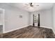 Bedroom featuring wood flooring, neutral walls, a ceiling fan and a window for natural light at 210 Joe Green Ln, Canton, GA 30114