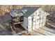 An elevated rear view of a house with a three-car garage and screened in porch at 210 Joe Green Ln, Canton, GA 30114