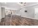 Bright living room with hardwood flooring, leading to a kitchen island and open layout at 210 Joe Green Ln, Canton, GA 30114