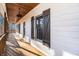 Inviting covered porch showcasing wooden decking, dark shutters, and a cozy outdoor ambiance at 210 Joe Green Ln, Canton, GA 30114