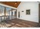 Screened in porch with wood floors and white exterior at 210 Joe Green Ln, Canton, GA 30114