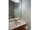 Clean and modern bathroom with vanity, sink and a large mirror at 3851 Guilderoy Ln # 1, Austell, GA 30106