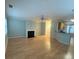 Open living room featuring hardwood floors, a fireplace and a ceiling fan at 3851 Guilderoy Ln # 1, Austell, GA 30106