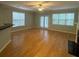 Bright living room with hardwood floors, fireplace and multiple windows at 3851 Guilderoy Ln # 1, Austell, GA 30106