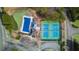 Aerial view showcasing a community pool and tennis courts, set in a well-maintained neighborhood at 4000 Rockingham Dr, Roswell, GA 30075