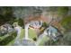 An aerial view shows a beautifully landscaped property nestled amongst mature trees at 4000 Rockingham Dr, Roswell, GA 30075