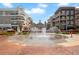 Beautiful fountains surrounded by apartments and shops in a vibrant urban setting at 4000 Rockingham Dr, Roswell, GA 30075