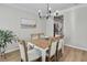 Elegant dining room with hardwood floors, stylish chandelier, and neutral decor, ideal for entertaining at 4000 Rockingham Dr, Roswell, GA 30075