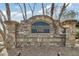 Elegant stone entrance sign for Huntington Park, set against a backdrop of lush greenery at 4000 Rockingham Dr, Roswell, GA 30075