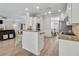 Modern kitchen showcasing barstool seating, granite counters, and easy access to dining area and living room at 4000 Rockingham Dr, Roswell, GA 30075