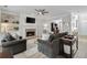 Inviting living room featuring a fireplace, built-in shelving, and views into a dedicated home office space at 4000 Rockingham Dr, Roswell, GA 30075