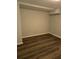 Basement area with wood-look flooring and a neutral color palette at 5709 Lee St, Morrow, GA 30260