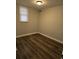 Bedroom featuring updated flooring, a window for natural light, and fresh paint at 5709 Lee St, Morrow, GA 30260