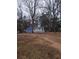 Exterior of home with shed and partially fenced in yard at 5709 Lee St, Morrow, GA 30260