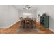 Dining room with wood floors, table, decor and a ceiling fan at 6851 Roswell Rd # F32, Sandy Springs, GA 30328