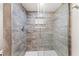 Beautiful tile shower with built-in niche shelving behind a frameless glass enclosure at 6851 Roswell Rd # F32, Sandy Springs, GA 30328