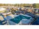 Aerial view of community pool and surrounding buildings with ample parking at 6851 Roswell Rd # F32, Sandy Springs, GA 30328