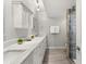 Bathroom featuring a long vanity with double sinks and a glass shower door at 6851 Roswell Rd # F32, Sandy Springs, GA 30328