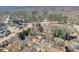 Aerial view of the neighborhood featuring mature trees and well-maintained homes at 893 Lance Cir, Lawrenceville, GA 30043