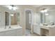 Bright bathroom features dual sinks, mirrors, and vanity area with natural light at 893 Lance Cir, Lawrenceville, GA 30043