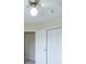 Bedroom featuring a ceiling fan, lighting, and closet with white bi-fold doors at 893 Lance Cir, Lawrenceville, GA 30043