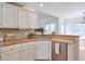 Kitchen with white cabinets, tile countertops, and stainless steel appliances at 893 Lance Cir, Lawrenceville, GA 30043