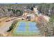 Aerial view of the community tennis courts and pool, perfect for recreation at 893 Lance Cir, Lawrenceville, GA 30043