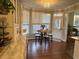 Charming breakfast nook featuring bay windows, hardwood floors, and custom cabinets at 108 Ardsley Run, Canton, GA 30115