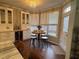 Bright breakfast nook with a bay window, hardwood floors, and a modern chandelier at 108 Ardsley Run, Canton, GA 30115