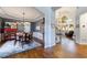 An elegant dining room with hardwood floors that flows into an airy living space at 108 Ardsley Run, Canton, GA 30115