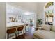 Stylish kitchen featuring a marble countertop bar that flows into a cozy living room at 108 Ardsley Run, Canton, GA 30115