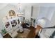 Open concept living room featuring a fireplace, large windows, and hardwood floors at 108 Ardsley Run, Canton, GA 30115