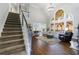 Grand living room with high ceilings, a staircase, and lots of windows for natural light at 108 Ardsley Run, Canton, GA 30115