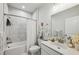 This bathroom features a tub/shower combo, neutral tiling, and ample counter space at 1322 Stanley Park Dr, Decatur, GA 30033