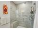 This bathroom features a seamless glass enclosed shower with a built-in bench and modern tiling at 1322 Stanley Park Dr, Decatur, GA 30033