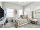 This stylish bedroom features a plush bed, bright windows, and a modern decor at 1322 Stanley Park Dr, Decatur, GA 30033